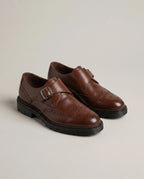 Chaussures homme à boucle perforées